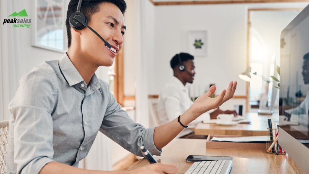 Sales person on computer.